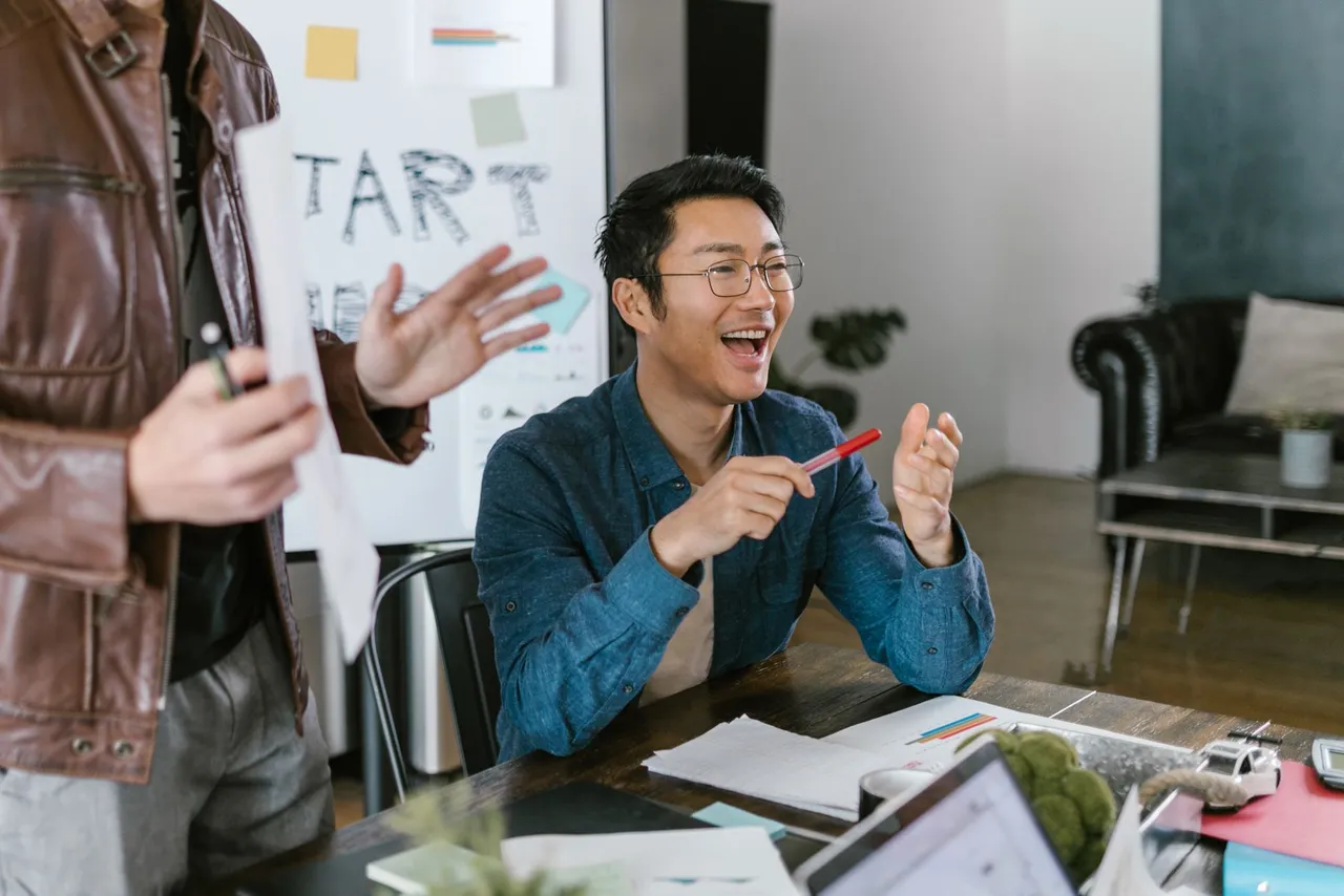 Startup team in a lively office meeting discussing ideas.
