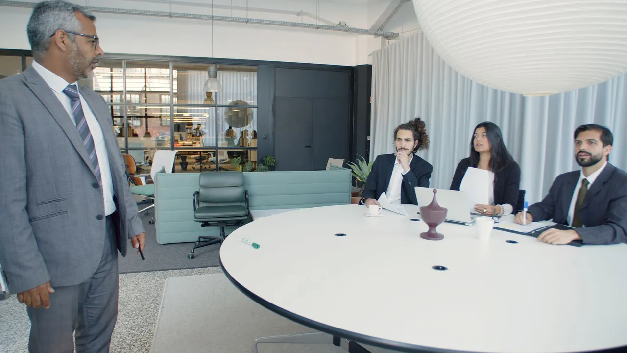 Professional business meeting with executives in a modern conference room