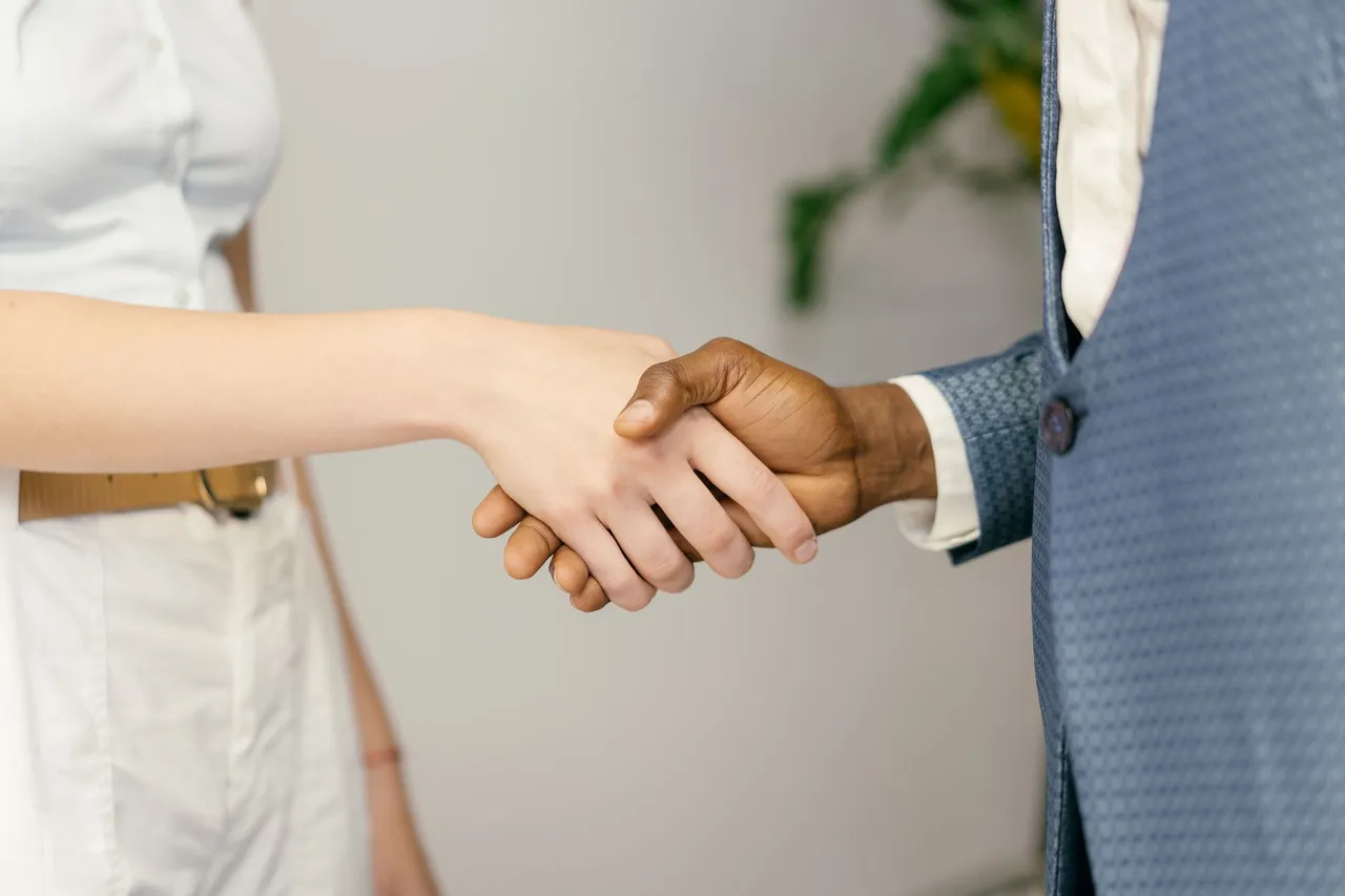 Close-up of a professional handshake symbolizing agreement and partnership in business.