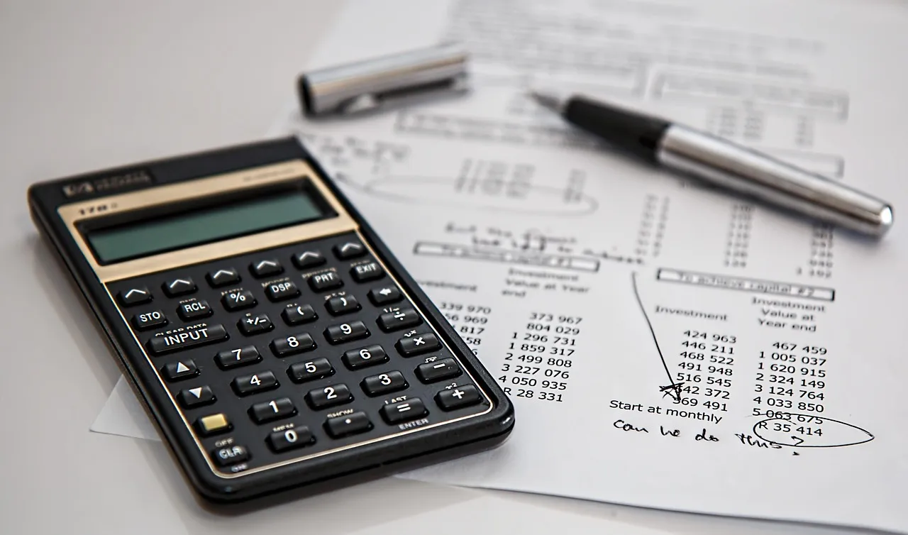 Stock photo related to calculator, calculation, insurance, finance for the topic of finance team accountants office